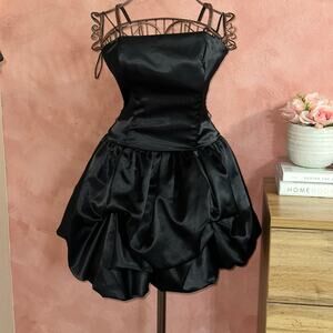 Black satin mini dress with ruffle bottom